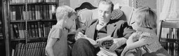 Father reading story to children